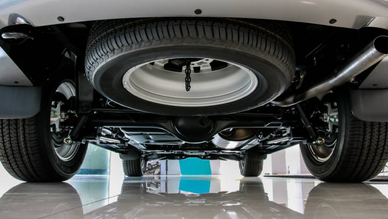 Spare wheel mounted under the car floor.