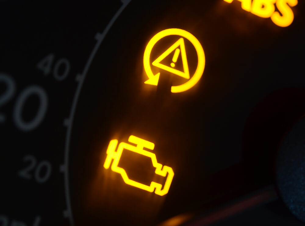 Malfunction or check engine car symbols dashboard closeup