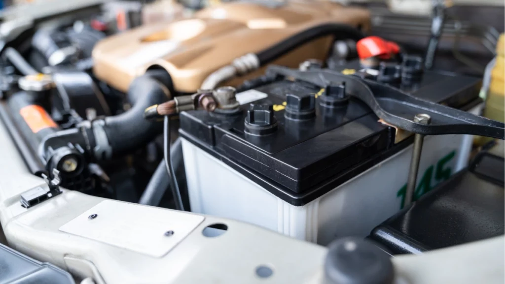 Auomobile repair, machine batteries car engine checking car battery cleaning for deliver customers in the car service.