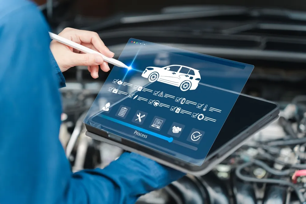 Women's Service Center Officers use tablets to check vehicle inspection and maintenance procedures for service