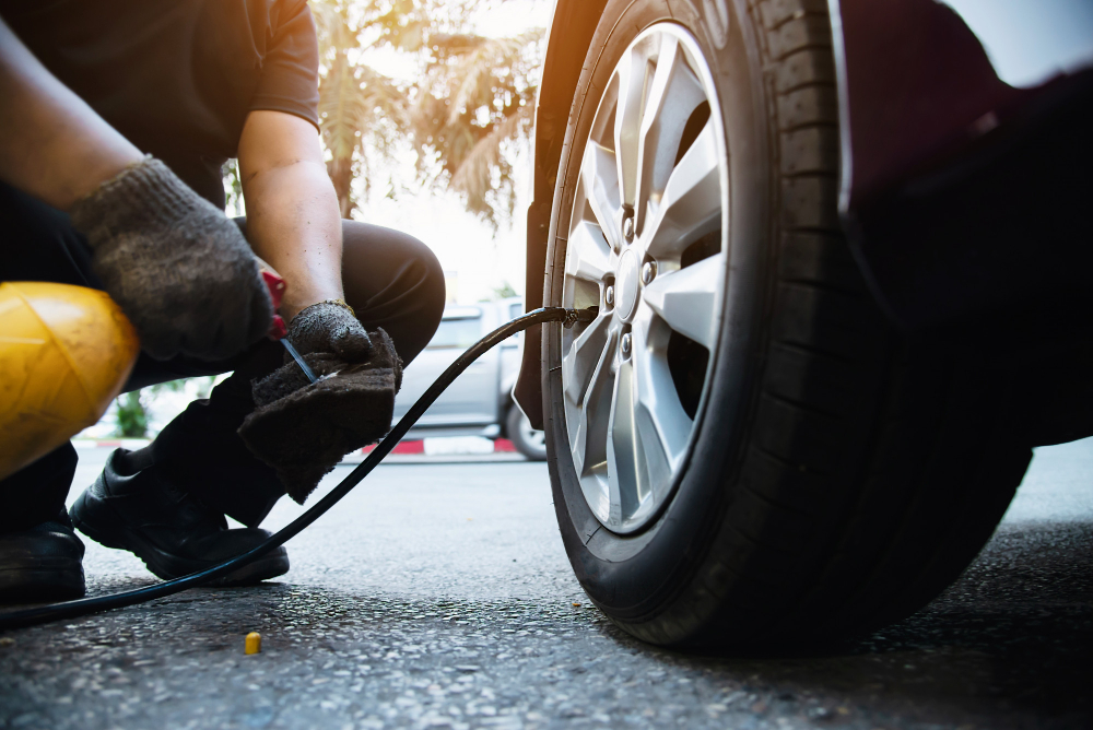 Technician is inflate car tire