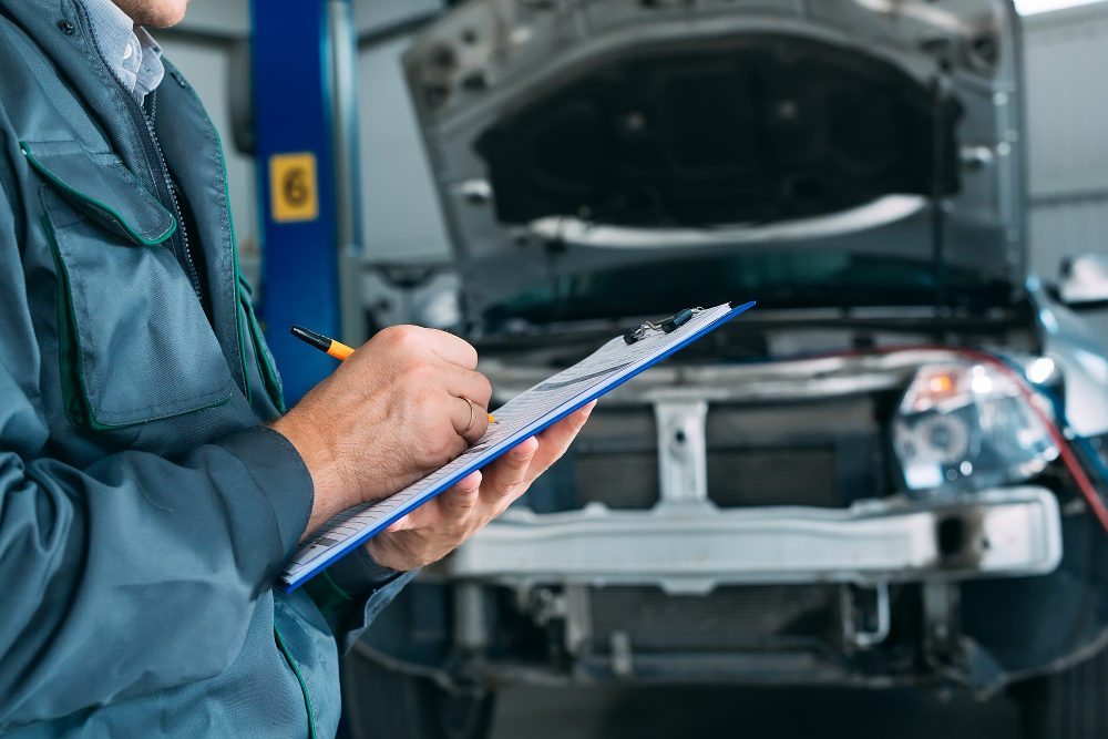 Mechanic maintaining car record